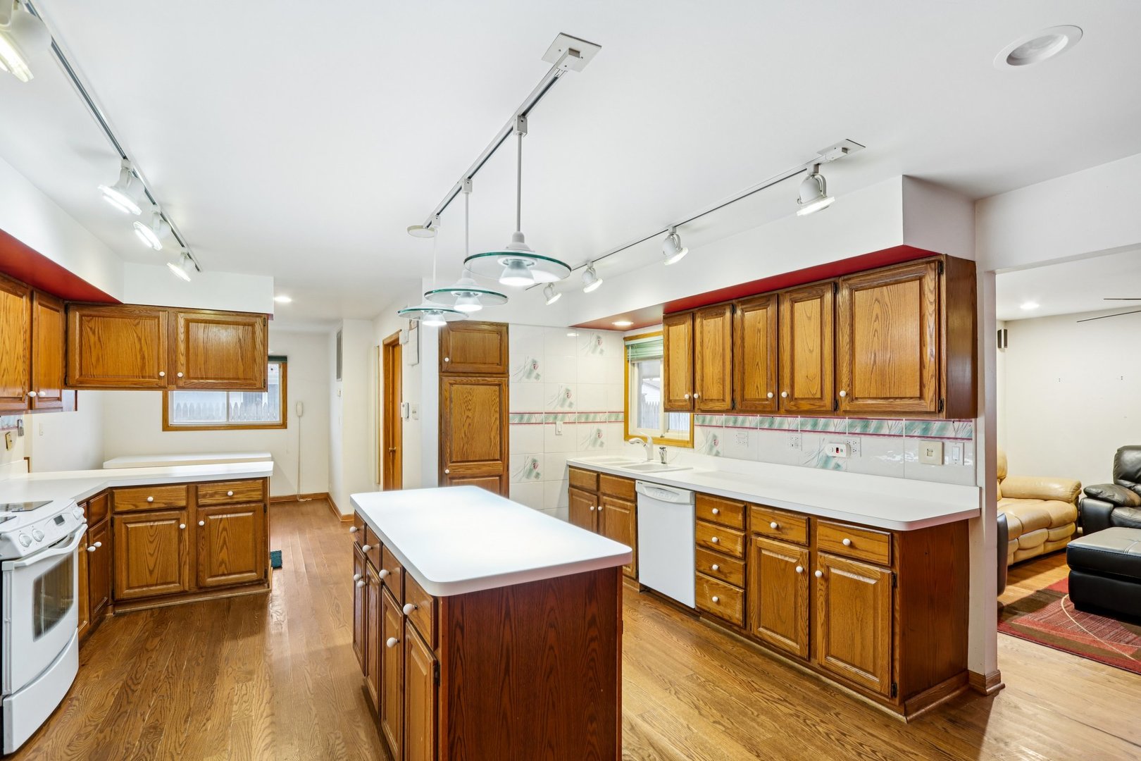 132 Tanglewood Drive Elk Grove Village, IL 60007 - Photo 10 of 42 a kitchen that has a lot of cabinets in it and wooden floors