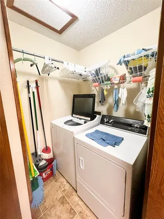 a view of a storage and utility room with a sink