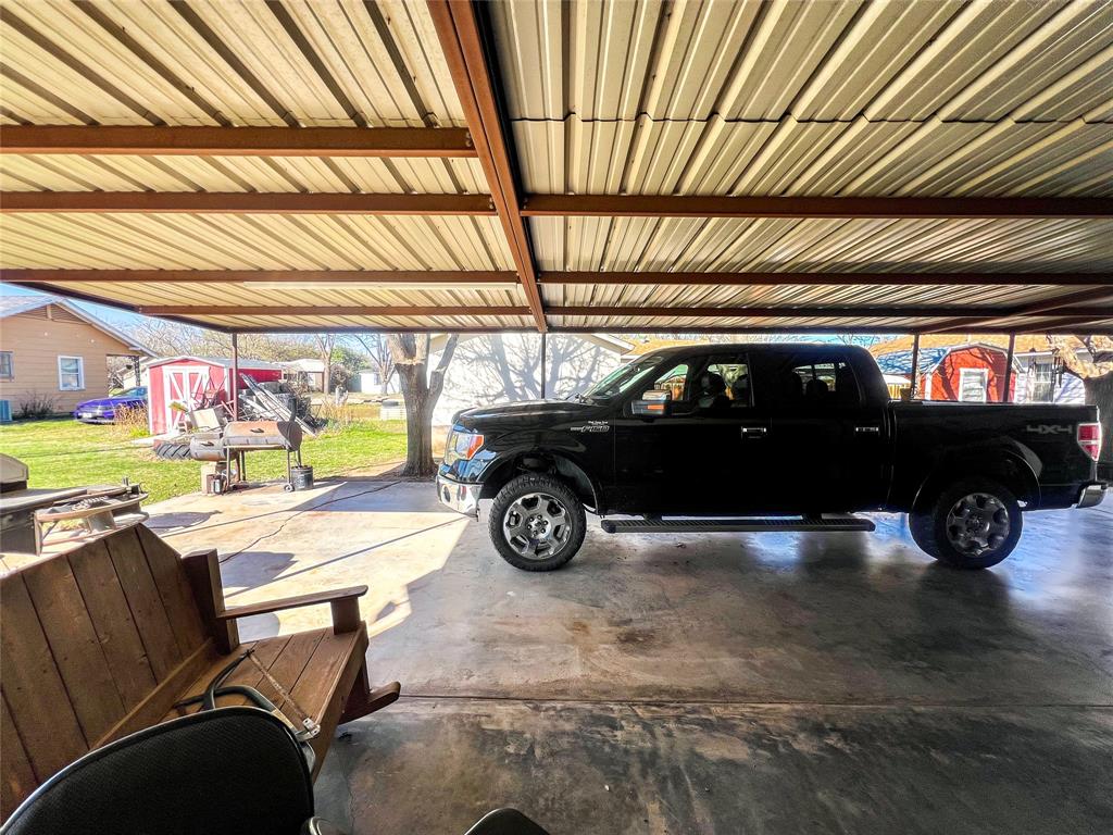 805 North 11th Street Haskell, TX 79521 - Photo 24 of 30 a view of parking garage with cars parked