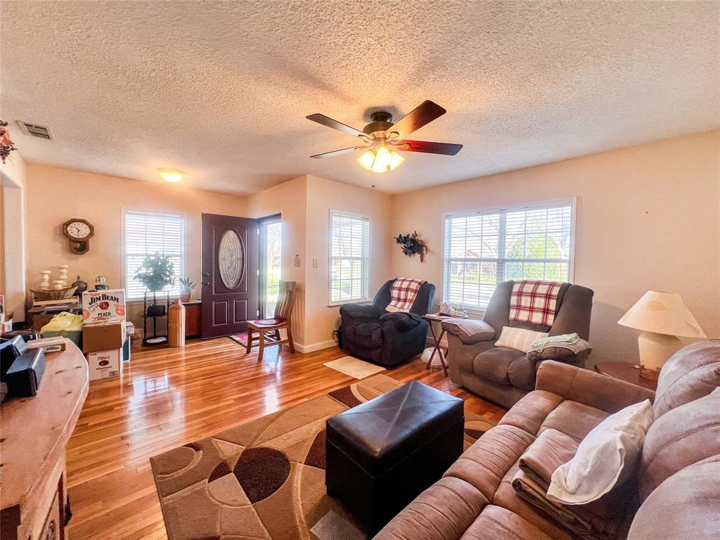 805 North 11th Street Haskell, TX 79521 - Photo 6 of 30 a living room with furniture and a large window