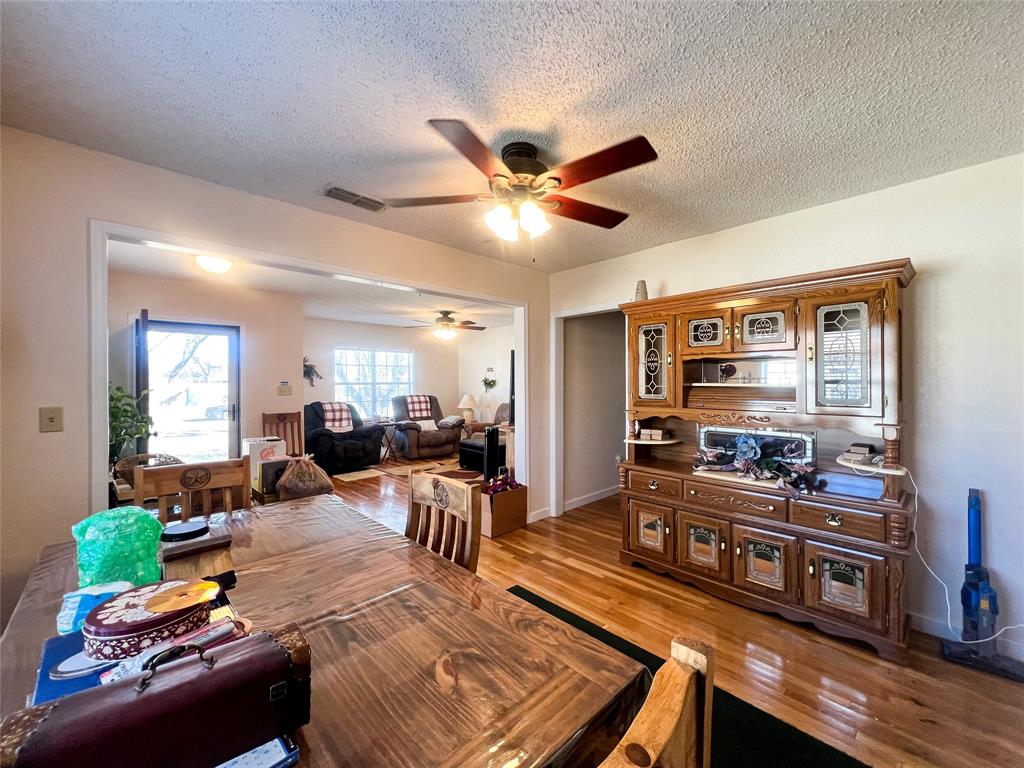 805 North 11th Street Haskell, TX 79521 - Photo 7 of 30 a living room with furniture and a flat screen tv