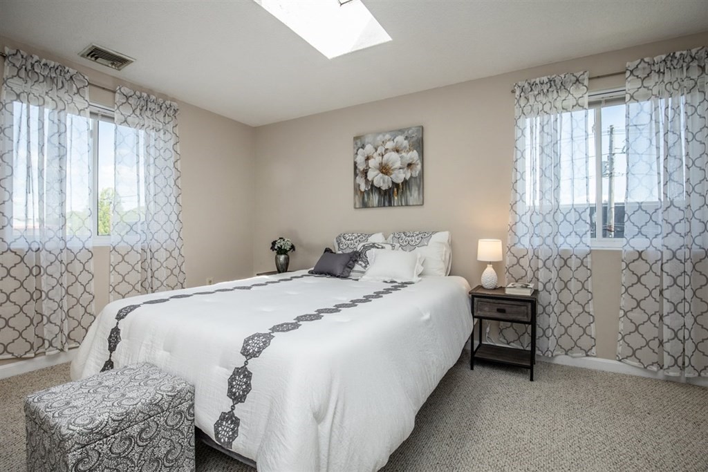 35 Prospect Street, Unit 301 Woburn, MA 01801 - Photo 12 of 19 a bedroom with a bed and a table