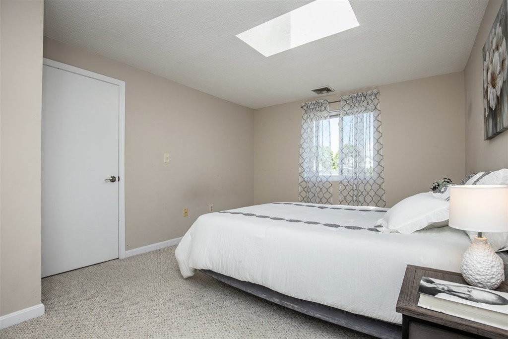 35 Prospect Street, Unit 301 Woburn, MA 01801 - Photo 13 of 19 a bedroom with a bed and window