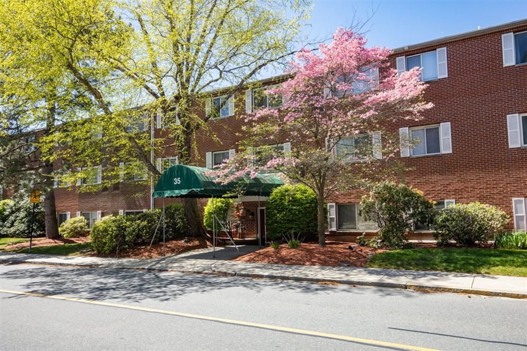 35 Prospect Street, Unit 301 Woburn, MA 01801 - Photo 2 of 19 a front view of a house with garden