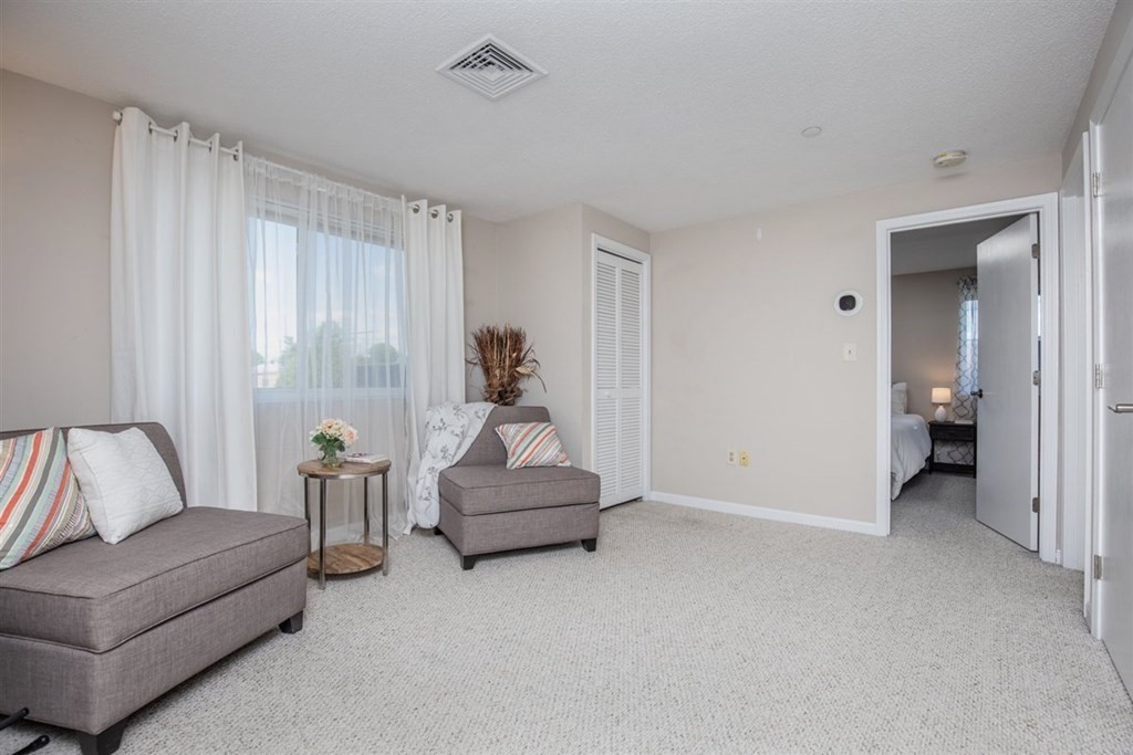 35 Prospect Street, Unit 301 Woburn, MA 01801 - Photo 4 of 19 a living room with furniture and a couch