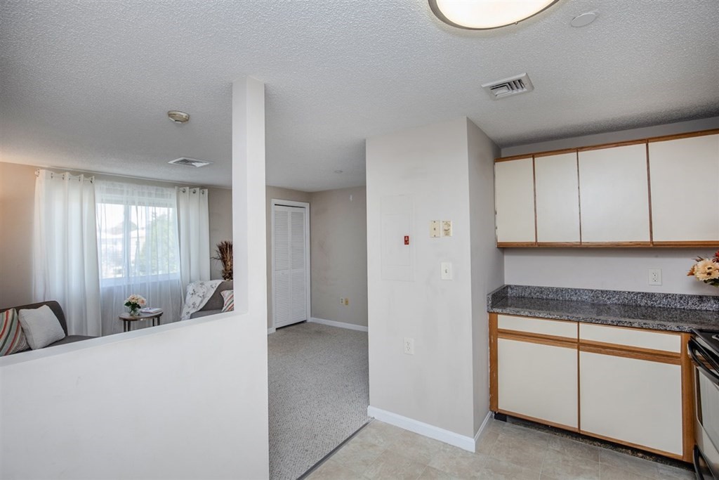 35 Prospect Street, Unit 301 Woburn, MA 01801 - Photo 10 of 19 a spacious bathroom with a granite countertop sink and mirror