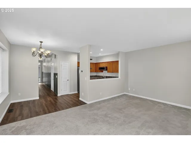 a view of a kitchen with wooden floor