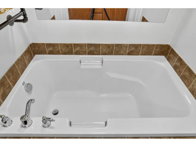 a bathroom with a bathtub and shower