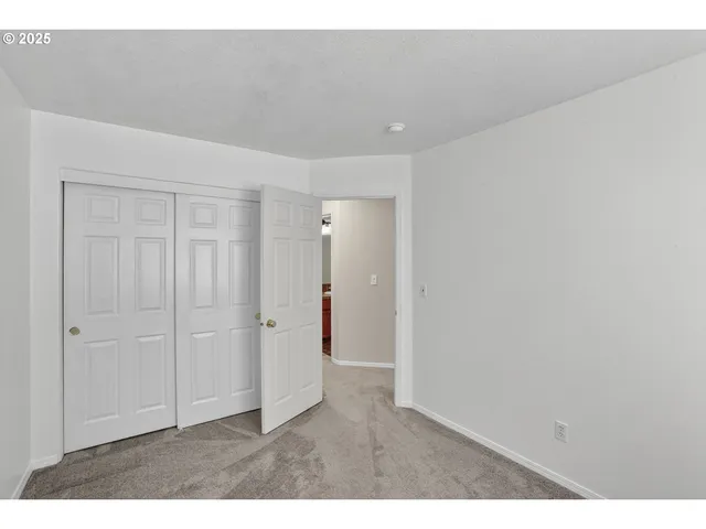 a bathroom with a sink a toilet a mirror and shower