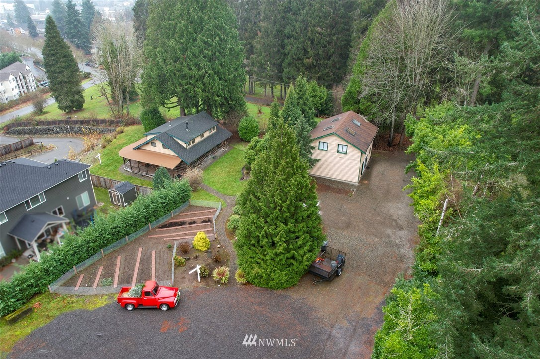 10907 Valley View Road Bothell, WA 98011 - Photo 1 of 32 an aerial view of a house with garden space and street view