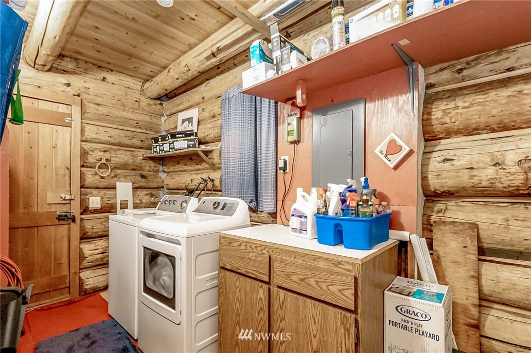 10907 Valley View Road Bothell, WA 98011 - Photo 22 of 32 a utility room with dryer and washer
