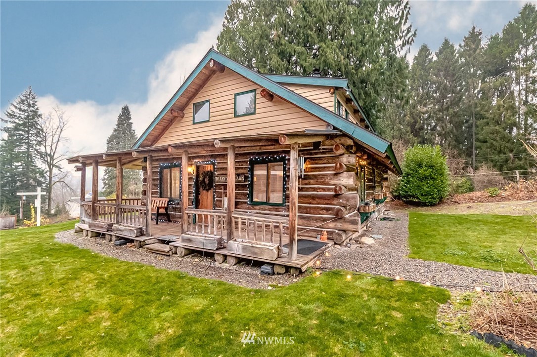 10907 Valley View Road Bothell, WA 98011 - Photo 5 of 32 a view of a house with a yard porch and sitting area