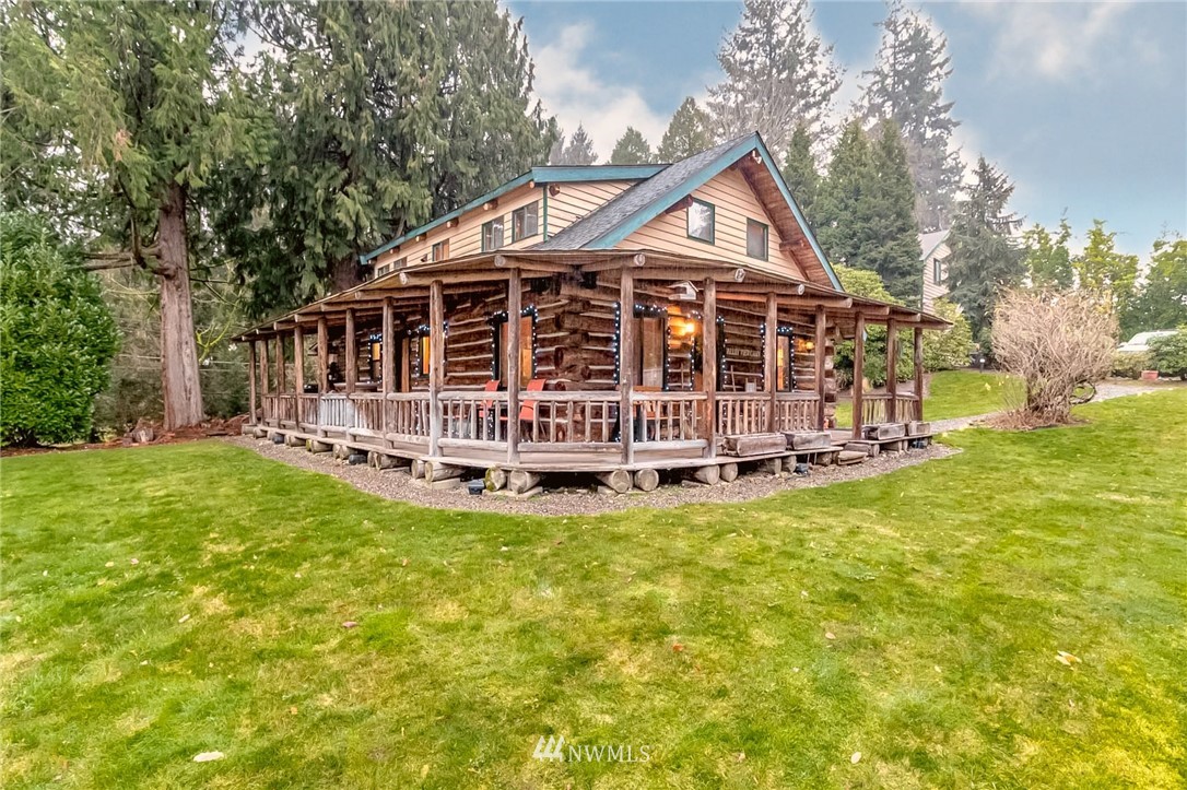 10907 Valley View Road Bothell, WA 98011 - Photo 6 of 32 a view of a house with backyard and wooden fence
