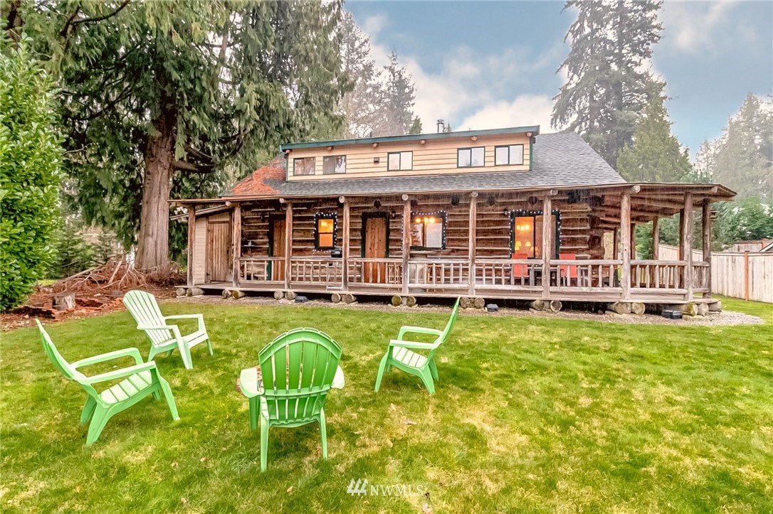 10907 Valley View Road Bothell, WA 98011 - Photo 7 of 32 a view of a house with pool and chairs