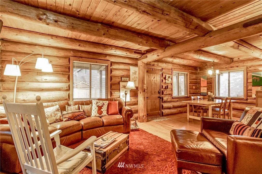10907 Valley View Road Bothell, WA 98011 - Photo 10 of 32 a living room with furniture and a large window