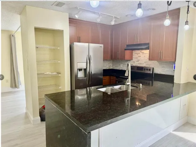 a view of empty room with floor to ceiling window