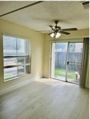 a view of an entryway with wooden floor