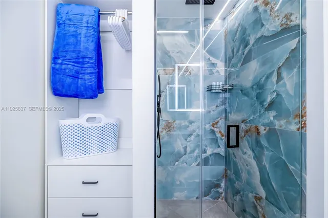 a bathroom with a sink a toilet and shower curtain