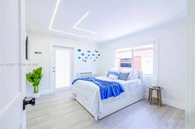 a view of swimming pool with a garden and plants