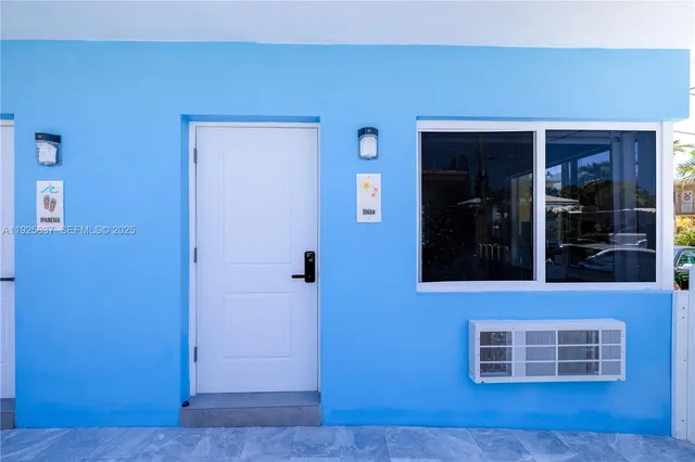 a bath room with a toilet a sink and a bath tub