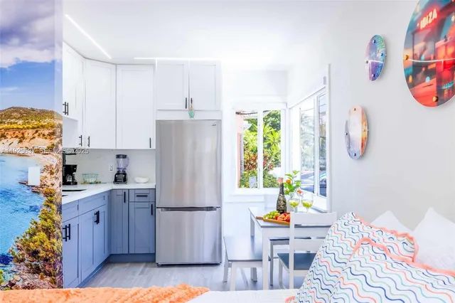 a bed room with a bed and a potted plant