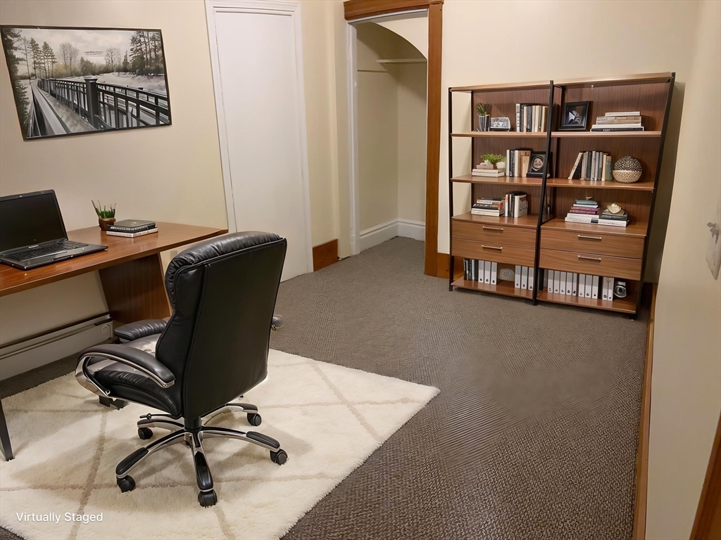 14 Gilkey Court, Unit 1 Watertown, MA 02472 - Photo 3 of 12 a view of a workspace with furniture