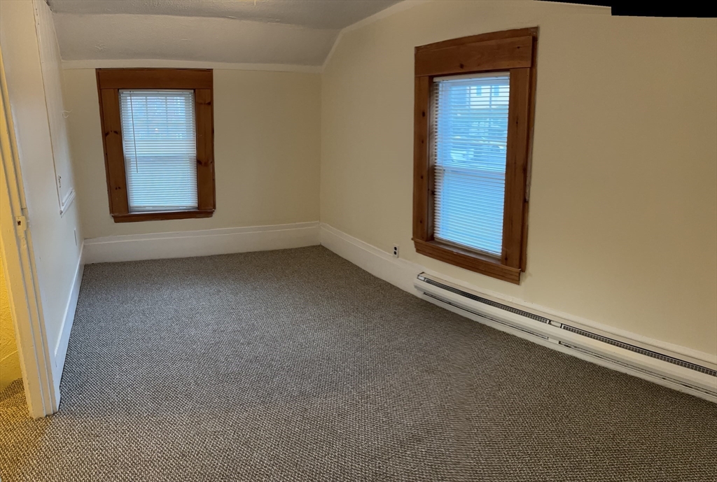 14 Gilkey Court, Unit 1 Watertown, MA 02472 - Photo 10 of 12 an empty room with windows