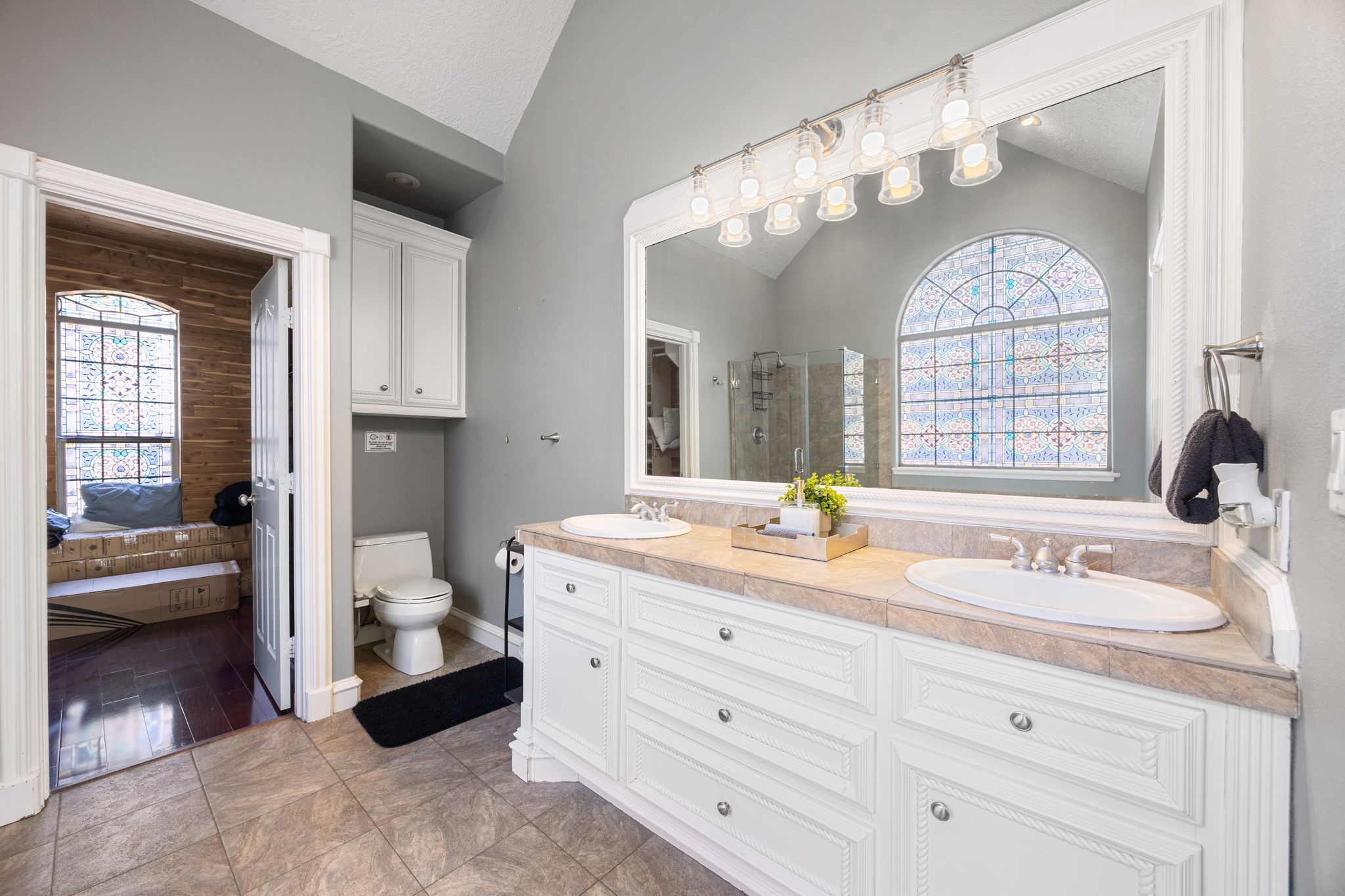 21427 Tophill Drive Spring, TX 77388 - Photo 31 of 50 a spacious en suite bathroom with a granite countertop sink mirror and a bathtub