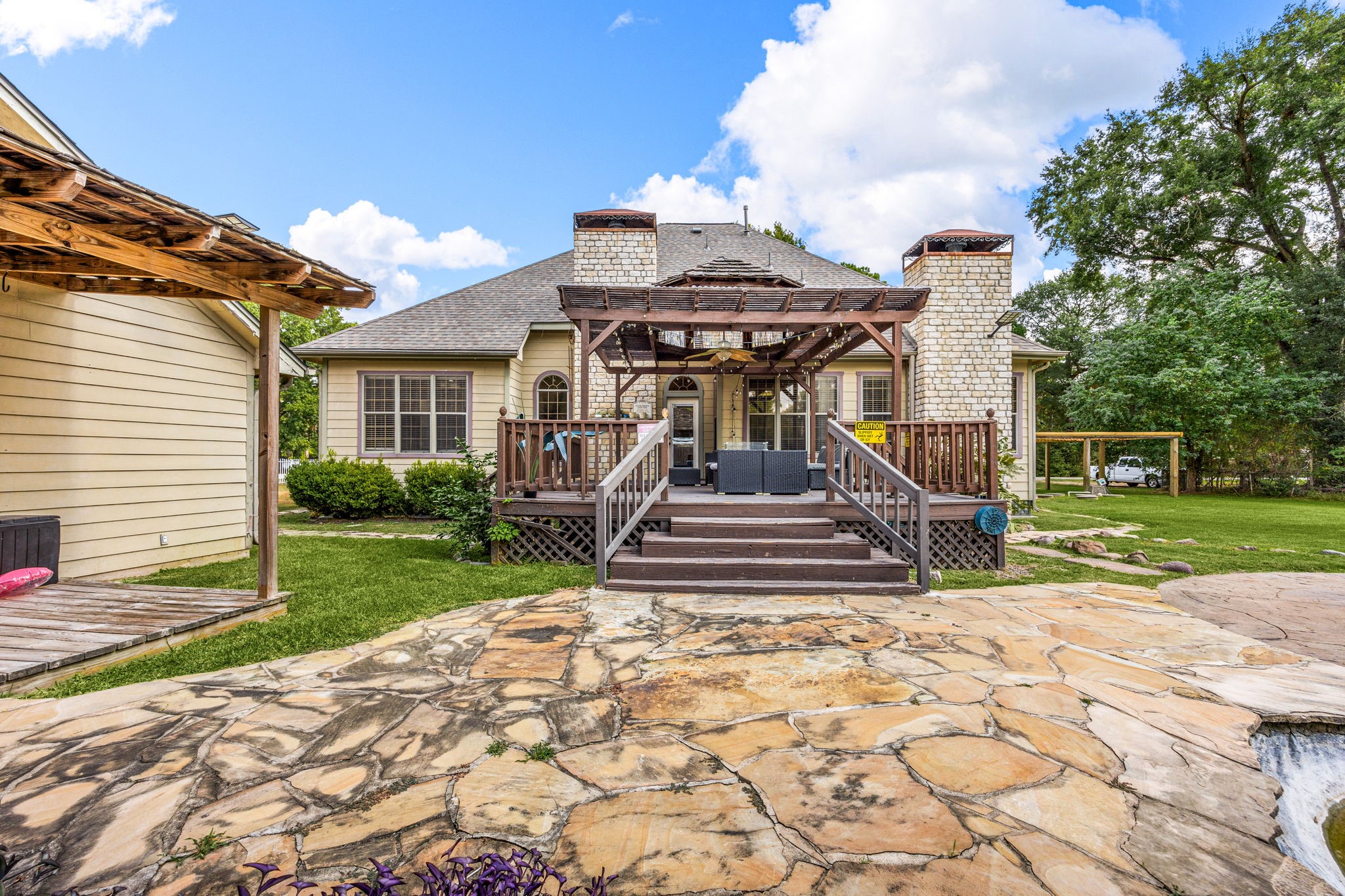 21427 Tophill Drive Spring, TX 77388 - Photo 49 of 50 a view of a house with a small yard and a large tree and plants