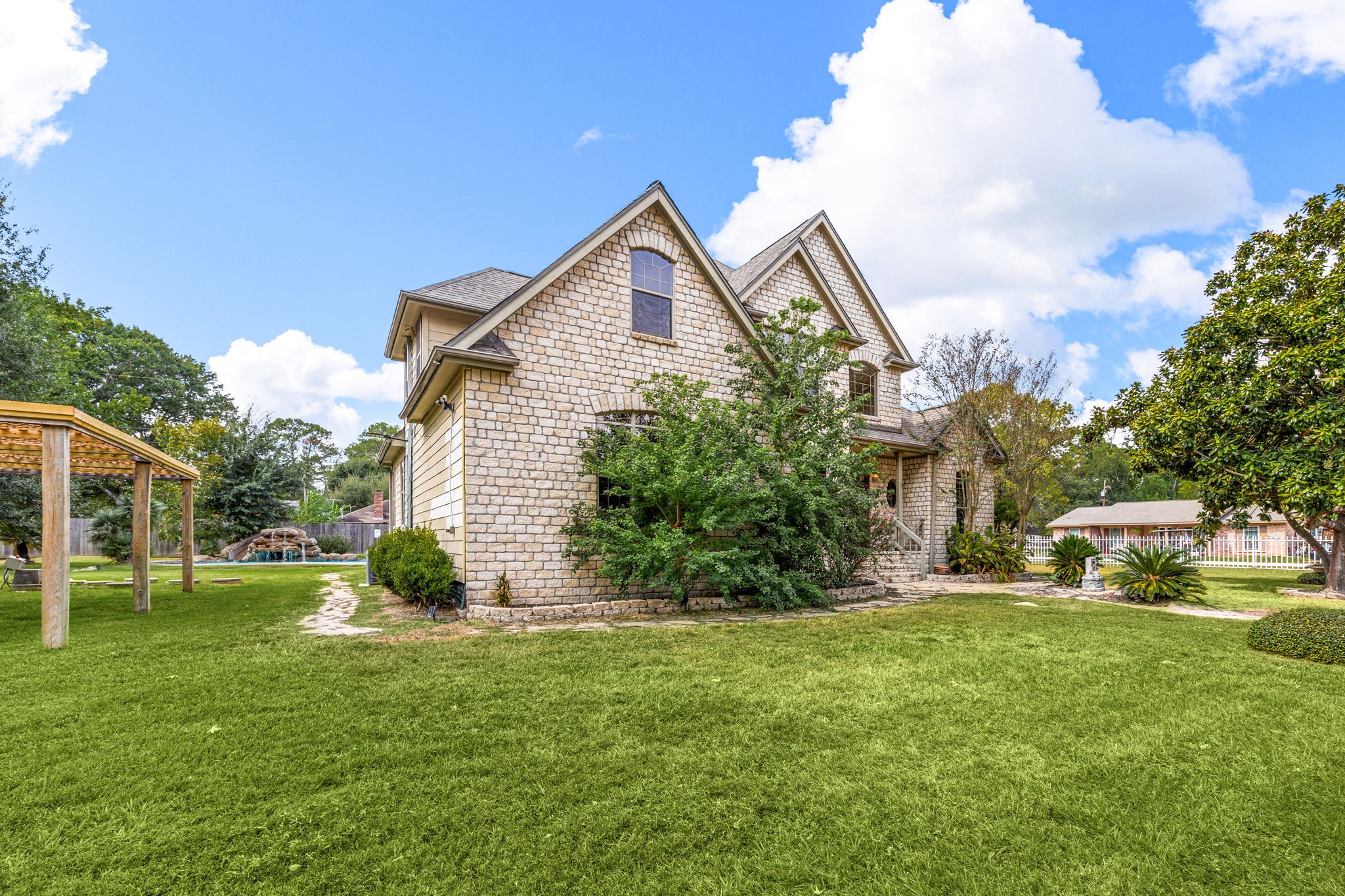 21427 Tophill Drive Spring, TX 77388 - Photo 6 of 50 a view of a house with a yard and sitting area