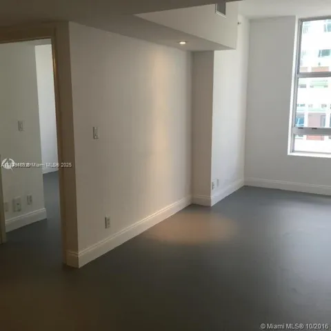 an empty room with closet area