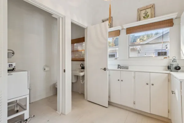 a bedroom with a large bed and a large window