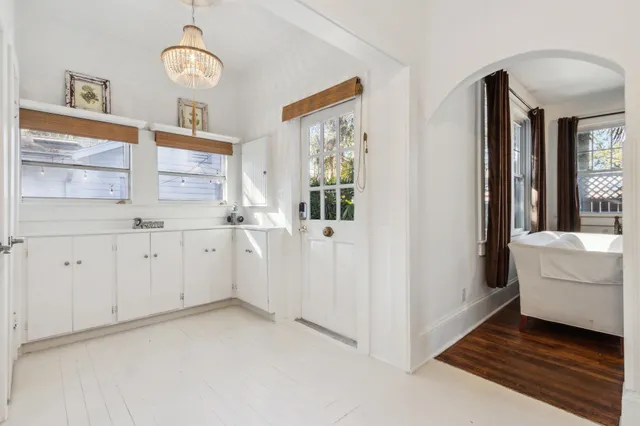 a bathroom with a toilet a sink and a window