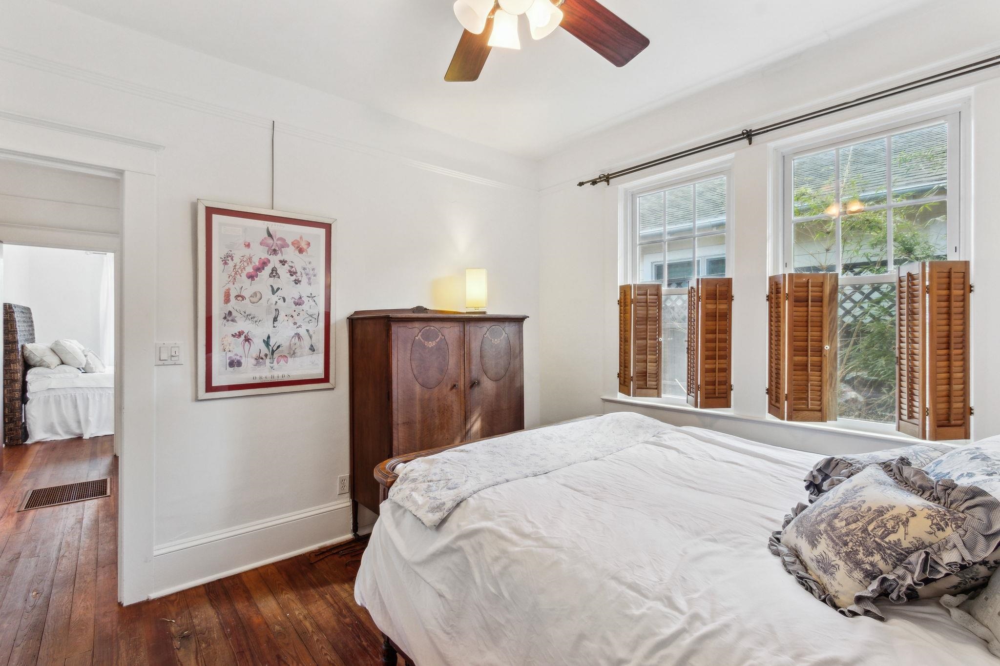 67 Park Place St. Augustine, FL 32084 - Photo 30 of 69 a bedroom with a large bed and a large window