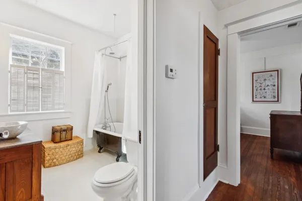 a view of a dinning table and chairs in patio of the house