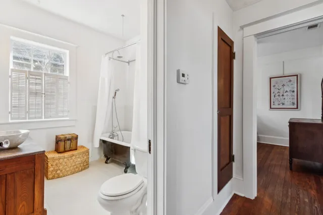 a view of a dinning table and chairs in patio of the house