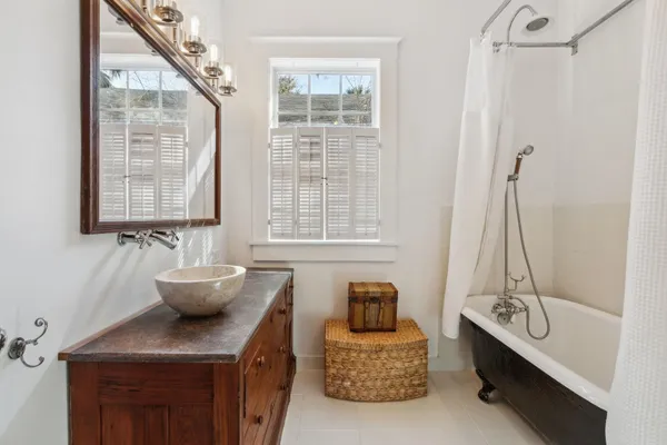a view of a house with swimming pool and sitting area