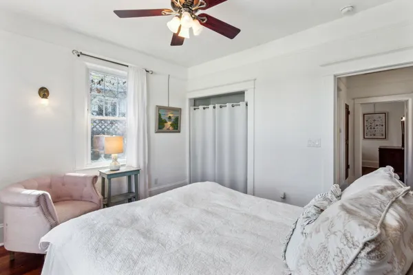 an aerial view of ocean and residential houses with outdoor space