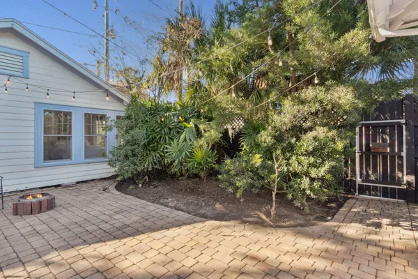 an aerial view of lake and residential houses with outdoor space