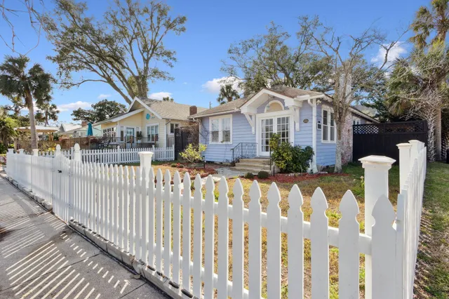 a front view of house with yard covered with green space