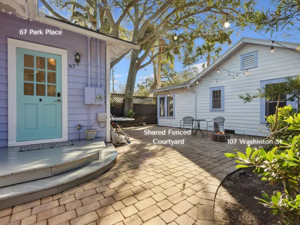 an aerial view of a houses with a lake view