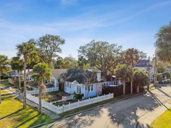 a view of a park with iron fence