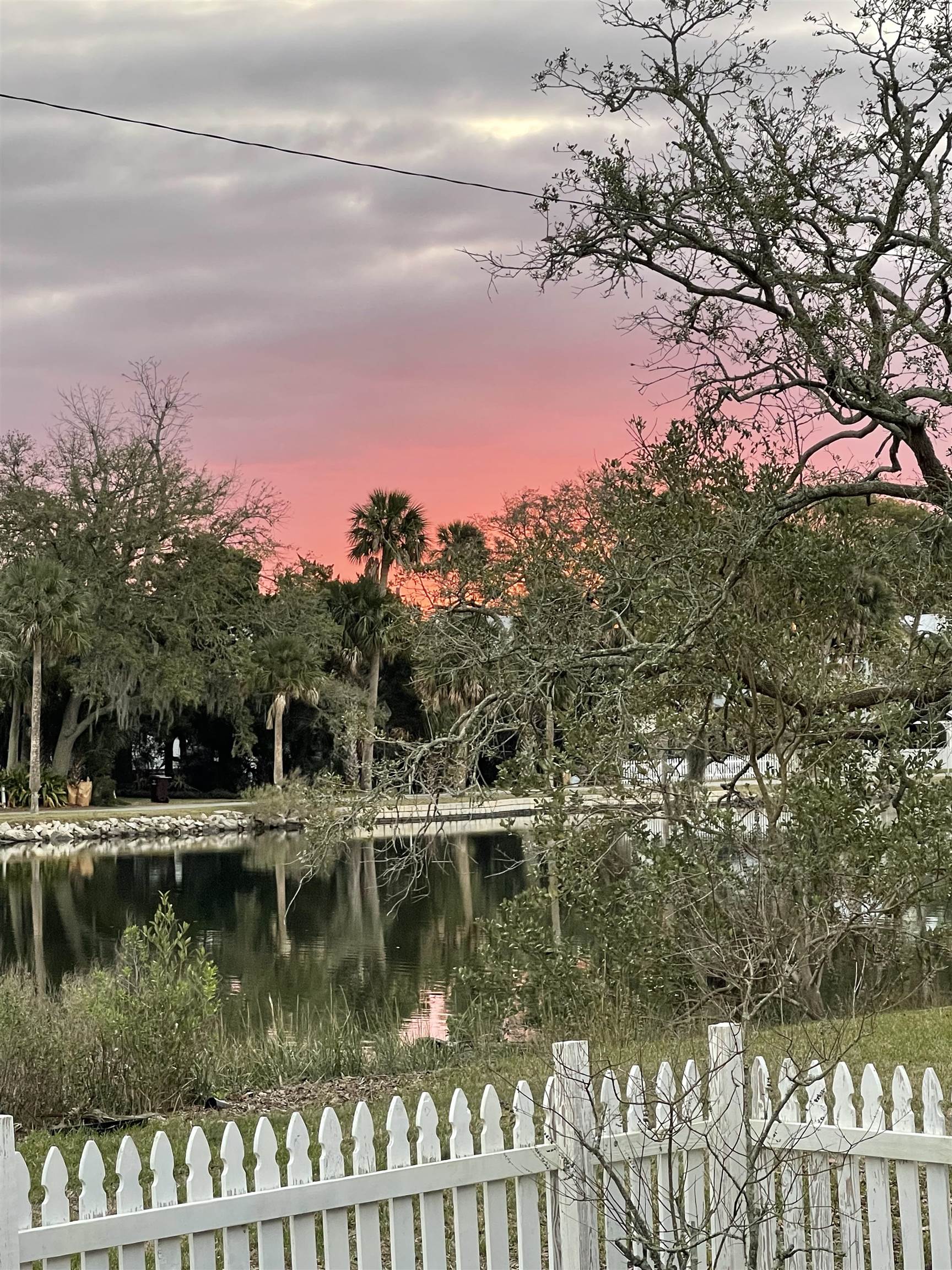 67 Park Place St. Augustine, FL 32084 - Photo 56 of 69 a view of a lake with a house in the background
