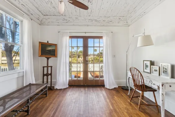 a view of livingroom with hardwood floor and workspace