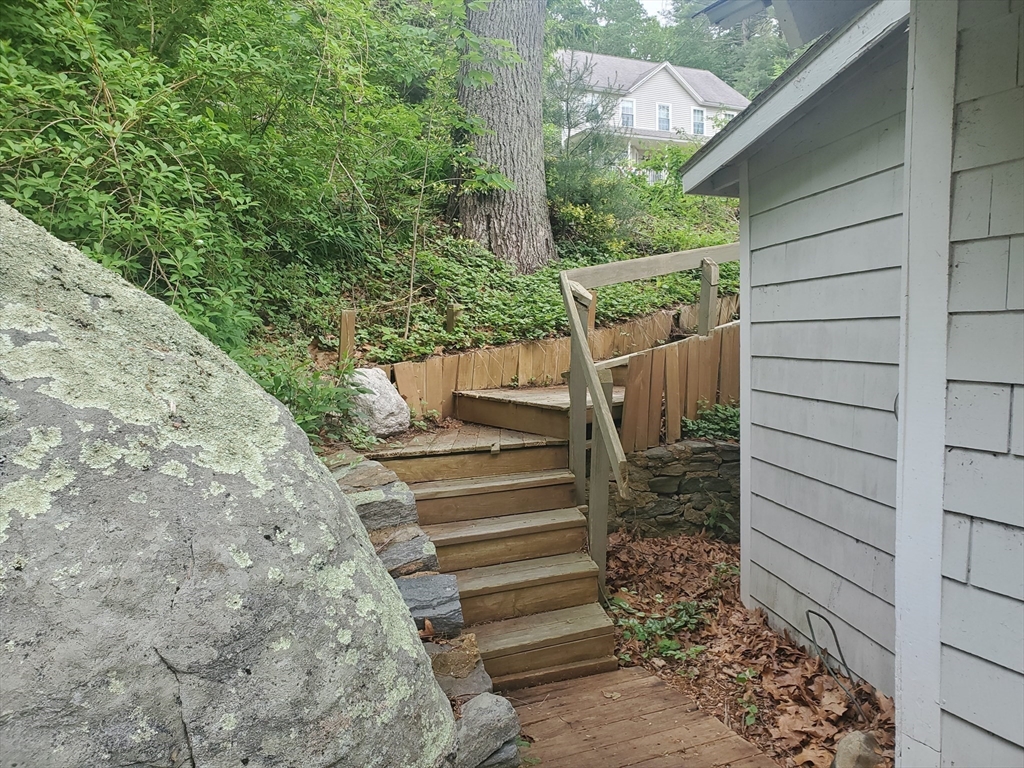 288 Clark Rd Extension Sturbridge, MA 01518 - Photo 3 of 14 a view of a pathway of a house with a garden