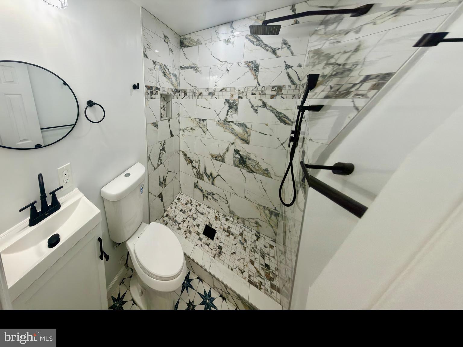 2129 Federal Street Baltimore, MD 21213 - Photo 11 of 27 a bathroom with a toilet and a sink