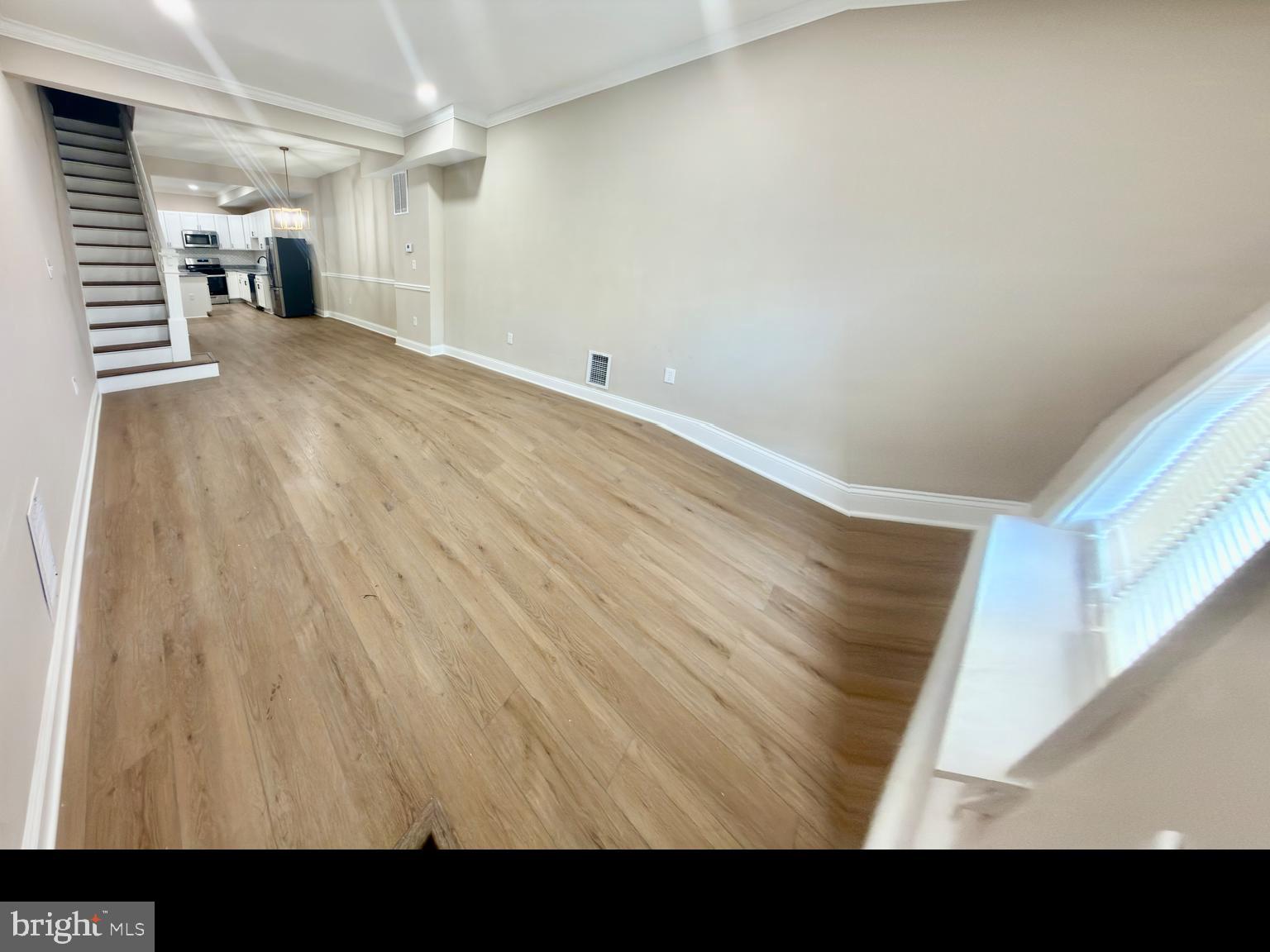 2129 Federal Street Baltimore, MD 21213 - Photo 18 of 27 a view of empty room with wooden floor