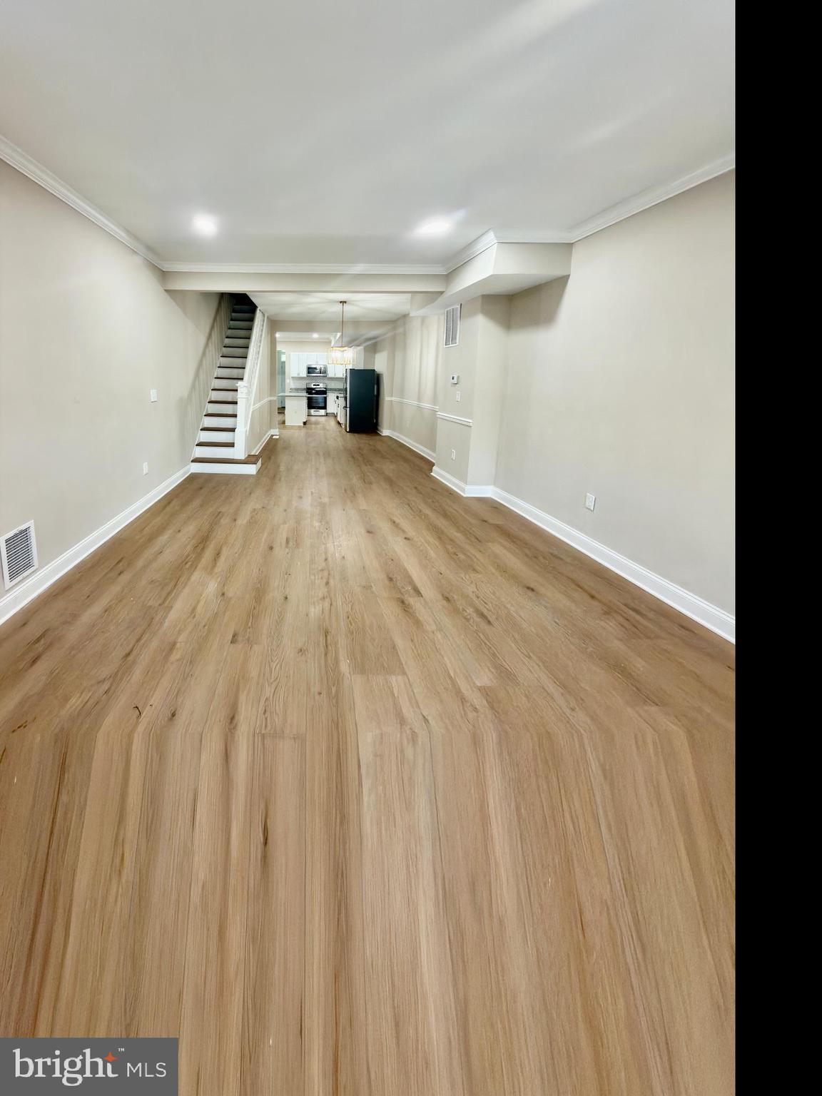 2129 Federal Street Baltimore, MD 21213 - Photo 19 of 27 a view of an empty room with a window