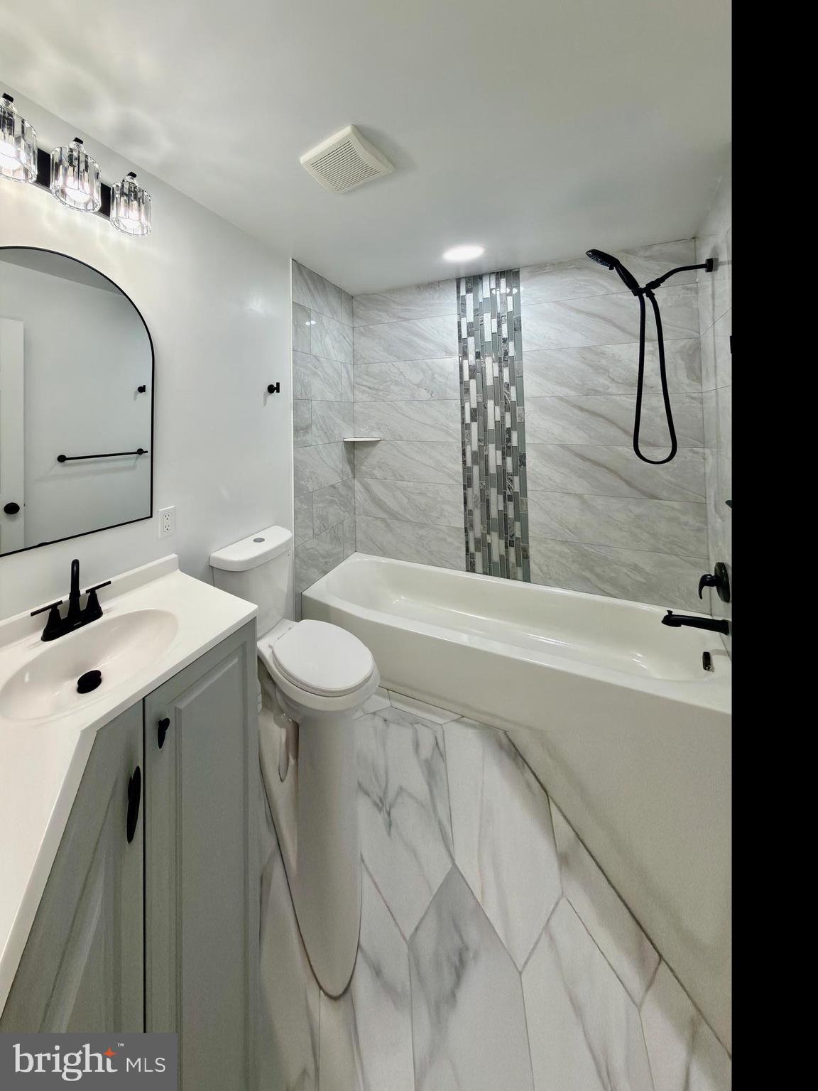 2129 Federal Street Baltimore, MD 21213 - Photo 7 of 27 a bathroom with a sink and mirror