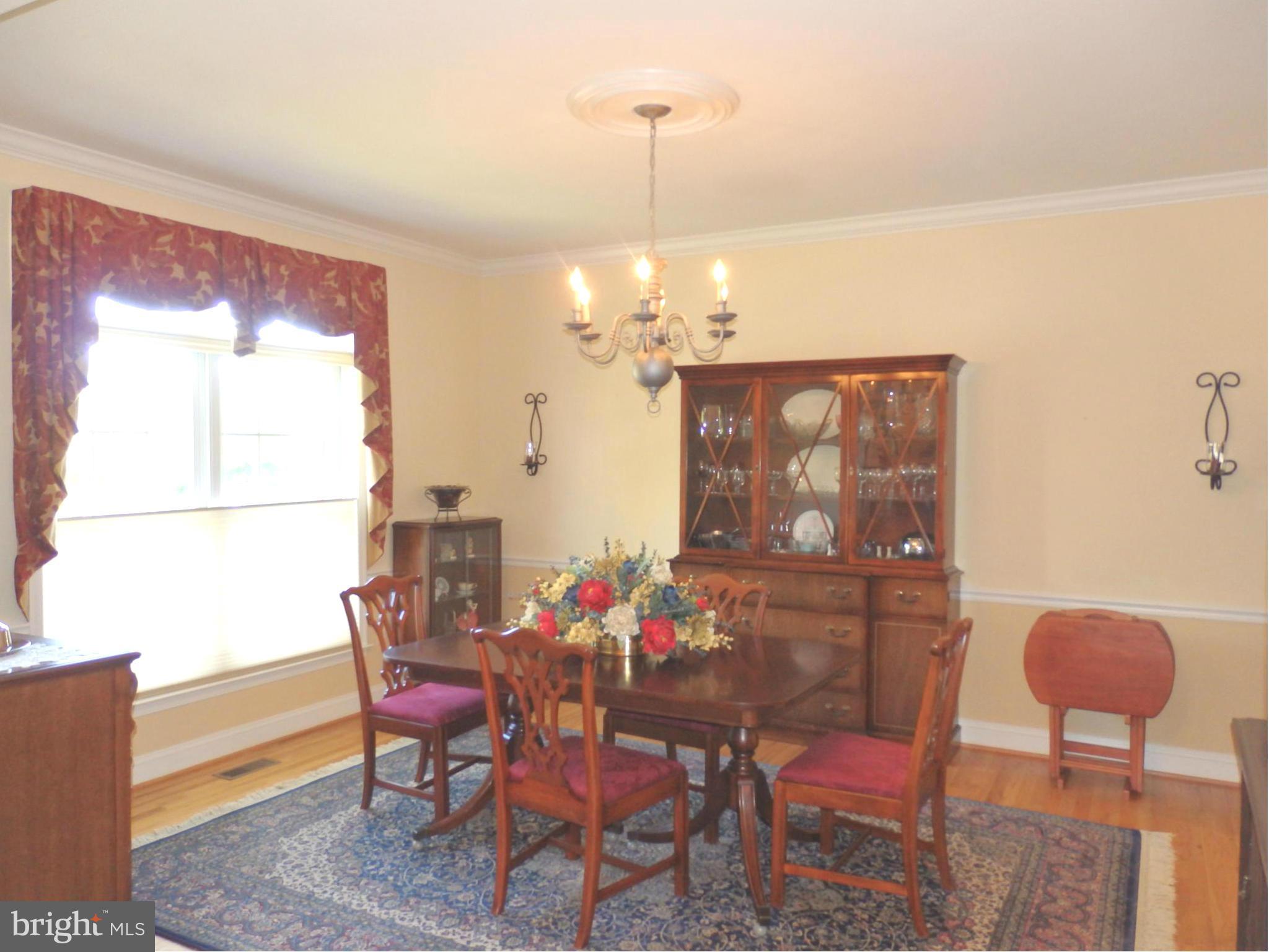 2643 Brook Valley Road Frederick, MD 21701 - Photo 7 of 30 Nice sized dining room with chandelier and molding
